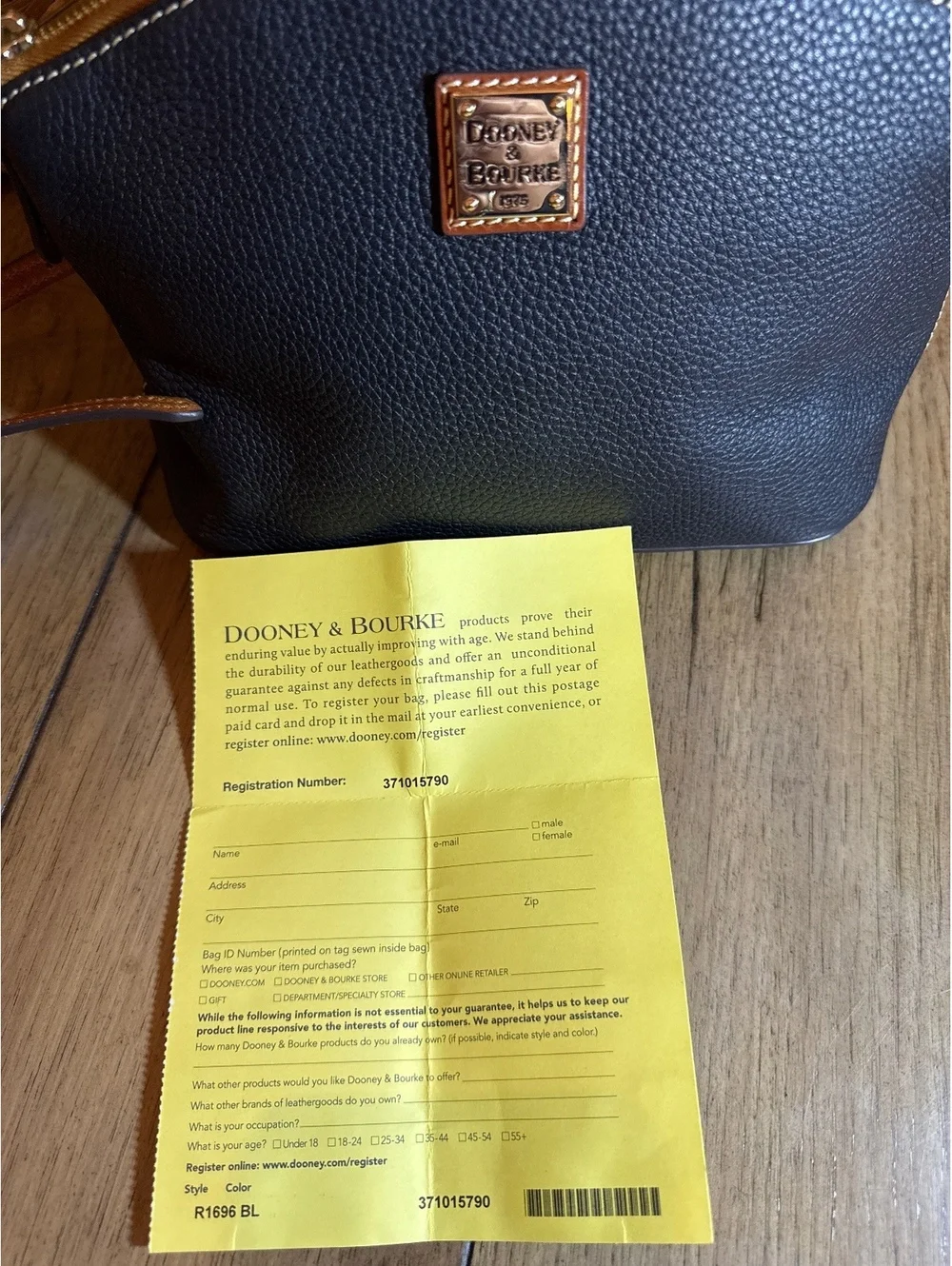 Authentic Dooney & Bourke Pebble Leather Crossbody Bag Black Tan Trim